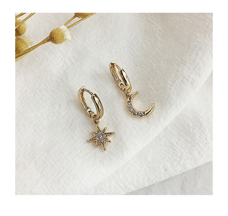 Star & Moon Huggie Hoop Earrings lifestyle shot